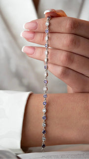 Silver Rhodium-Plated Round Design Bracelet with Purple Stone”