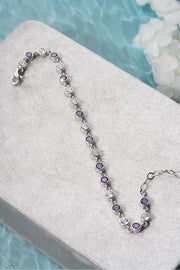 Silver Rhodium-Plated Round Design Bracelet with Purple Stone”
