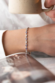 Silver Rhodium-Plated Round Design Bracelet with Purple Stone”