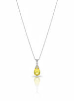 A sterling silver necklace with a round, disc-shaped pendant that has a unique, fingerprint-like texture. The necklace is displayed against a soft neutral background.