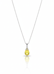 A sterling silver necklace with a round, disc-shaped pendant that has a unique, fingerprint-like texture. The necklace is displayed against a soft neutral background.