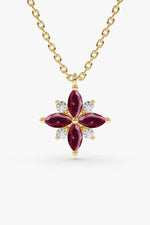 A sterling silver necklace with a circular pendant featuring a minimalist cutout of a mother holding a child, displayed against a soft neutral background.