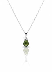 A sterling silver necklace with a circular pendant on a soft neutral background. The pendant has a high-polish finish and features a cutout star at its center.