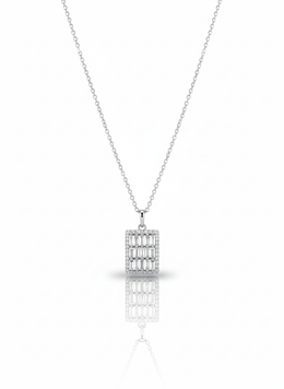 A sterling silver necklace with a circular pendant containing a coiled snake cutout. The necklace is displayed against a soft neutral background, with the pendant catching the light.