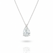  A silver chain necklace featuring a single, sparkling, pear-shaped clear gemstone pendant held in a three-prong setting against a white background.